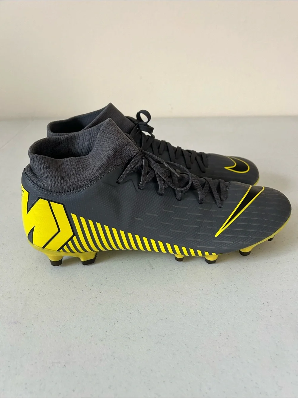 Nike Men’s Black Soccer Cleats with Yellow Swoosh